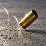 Stylized thumbnail for Brass Bullet Shell Drops on Cement